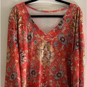 Beautiful fall tunic. Light red to orange print.